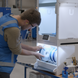 Operator loading spools into the UltiMaker Material Station
